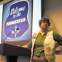 LHS President Becky Huber kicks off the presentation with slides illustrating the history of Tim's restaurants.